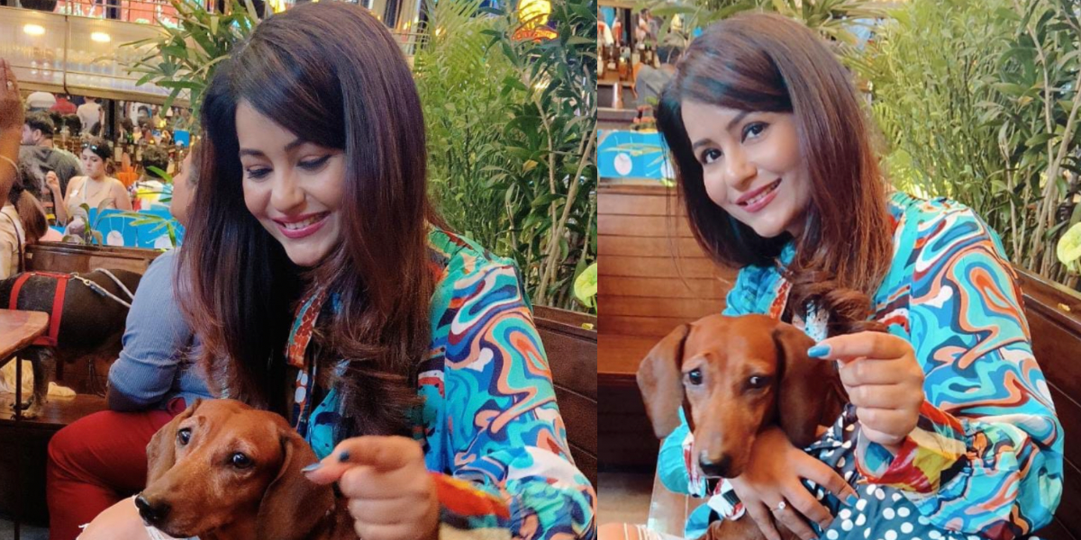 Adorable ! Charrul Malik and her dog Della party together