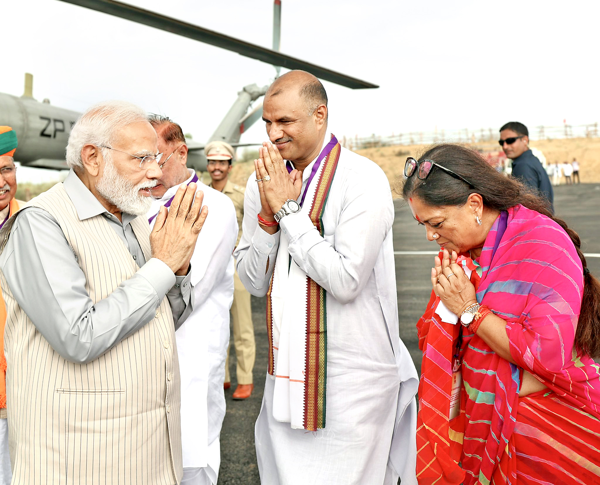 PM Narendra Modi was welcomed by Vasundhara Raje, CP Joshi and Arjun Meghwal at helipad in Dadiya, Jaipur