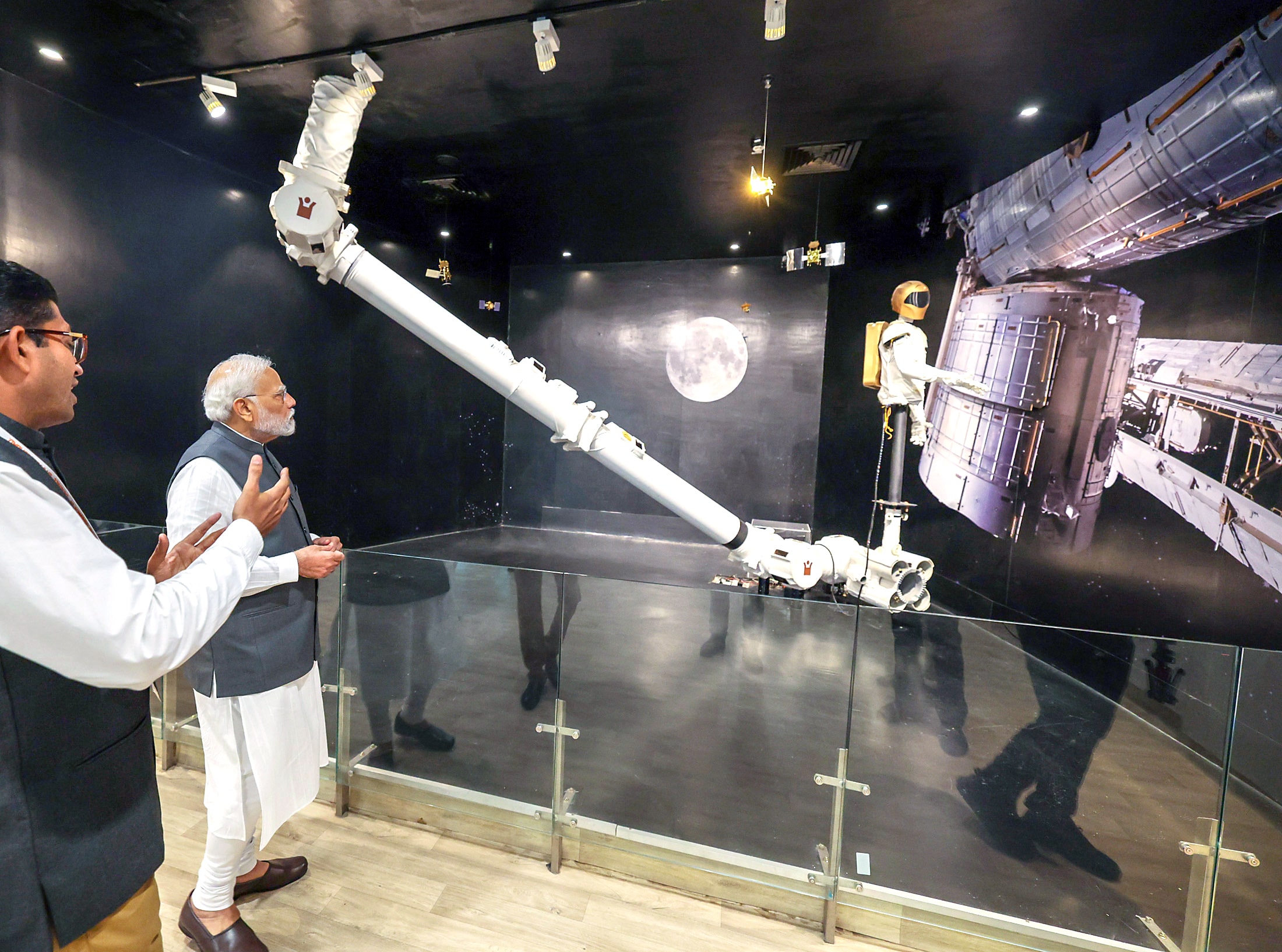 PM Narendra Modi gets a know-how about products at Robotics Gallery.