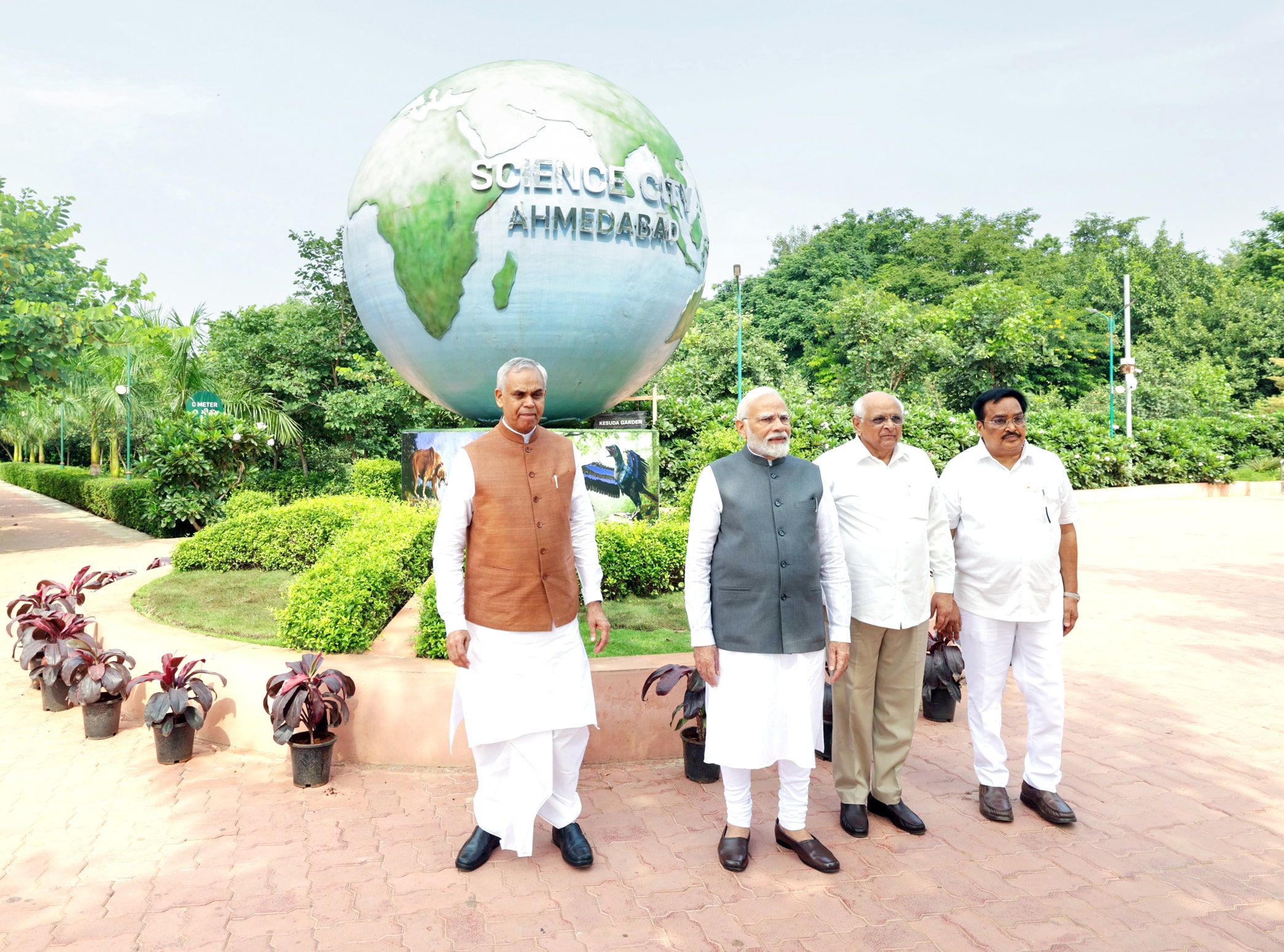 Prime Minister Narendra Modi poses for photo with Gujarat Governor Acharya Devvrat and CM Bhupendra Patel during his visit to Nature Park at Science City.