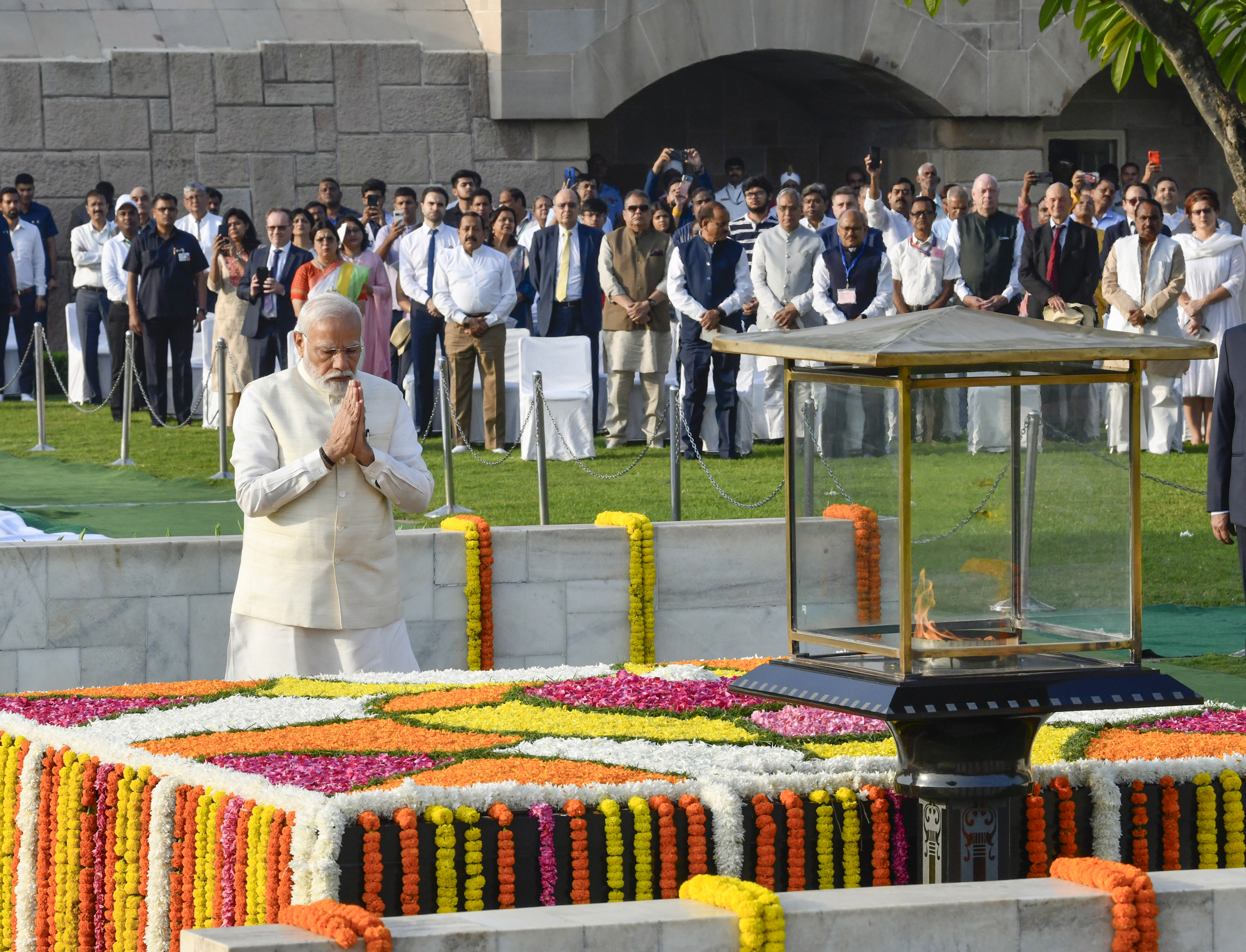 Prime Minister Narendra Modi pays homage to Mahatma Gandhi on the occasion of his birth anniversary, at Rajghat in New Delhi, on Monday. -PTI