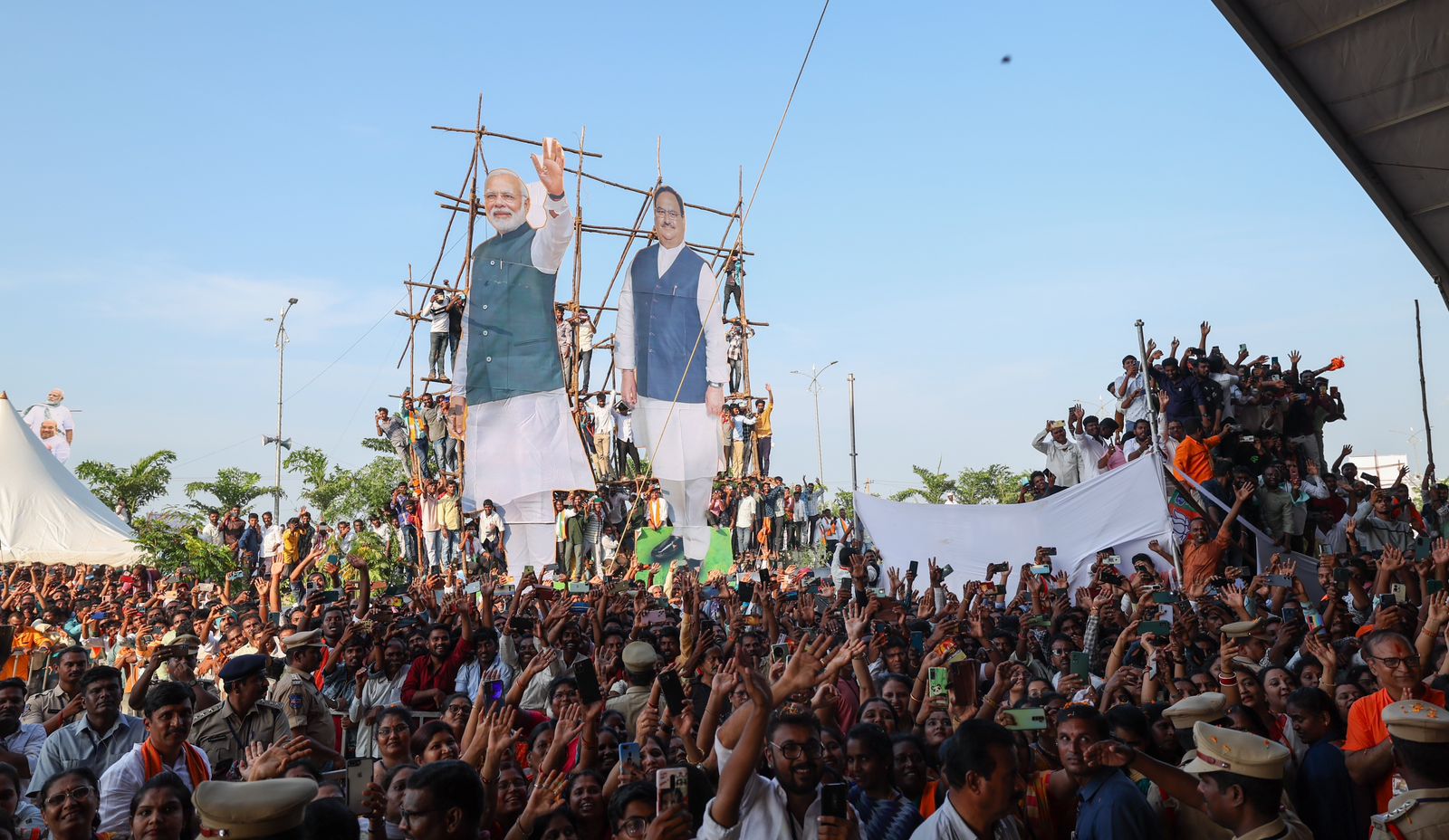 Supporters listen to Prime Minister Narendra Modi's speech during a public rally in Nizamabad on Tuesday.