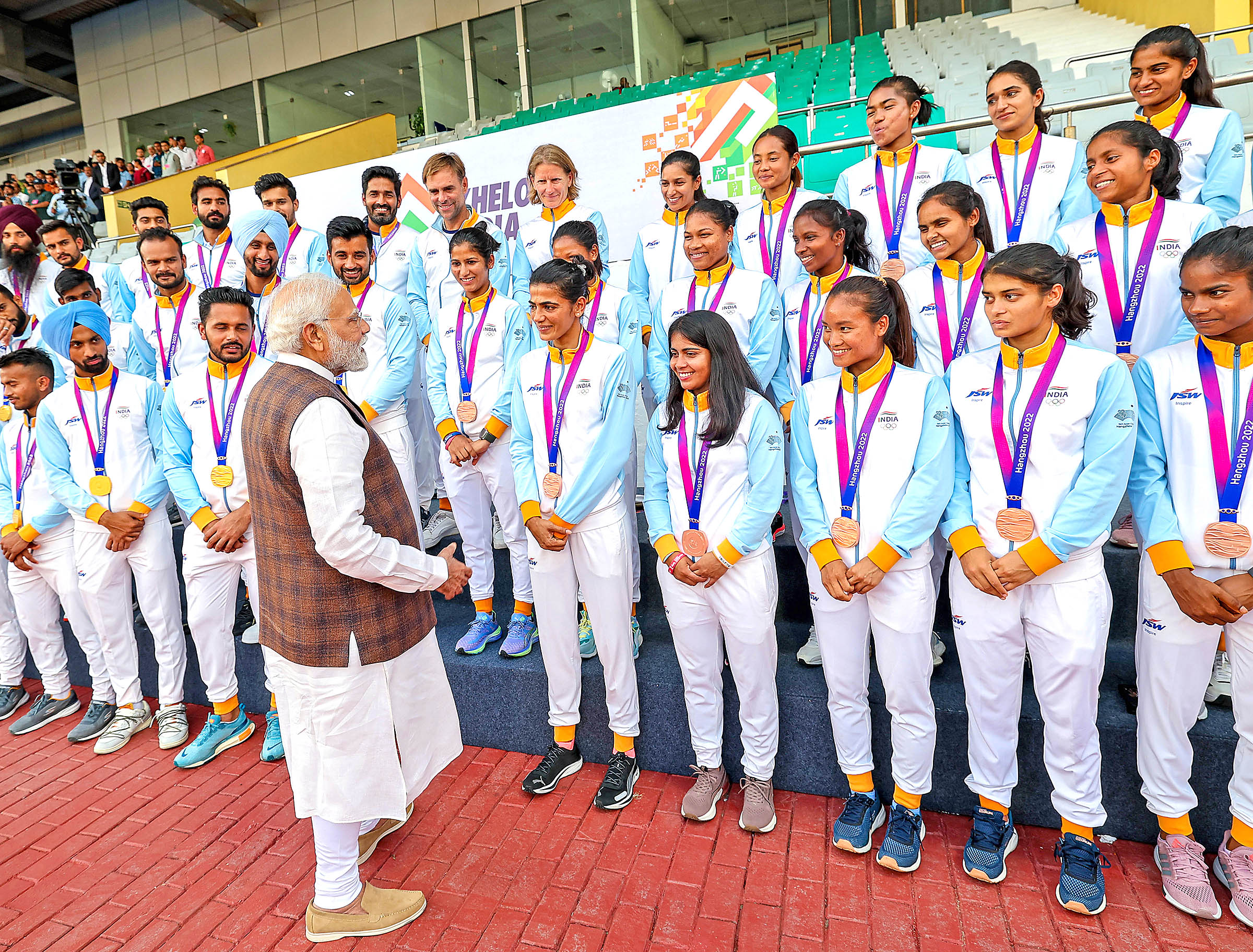 Modi interacts with hockey team players and appreciates them for their commendable performance in Asian Games.