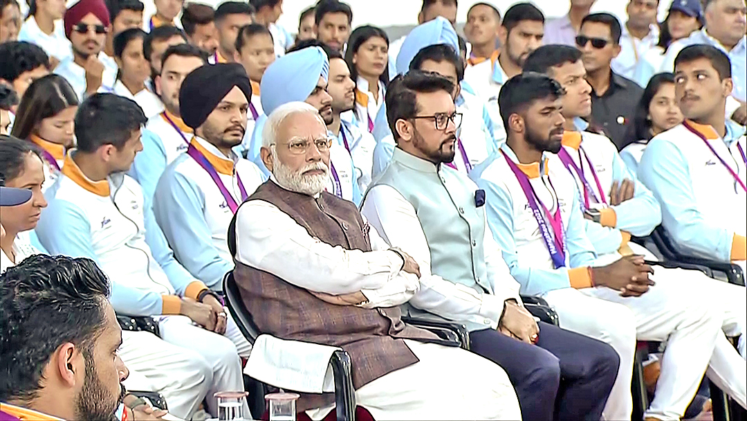 PM Narendra Modi with Union Minister for Sports and Youth Affairs Anurag Thakur during an interaction with the Indian athletes.