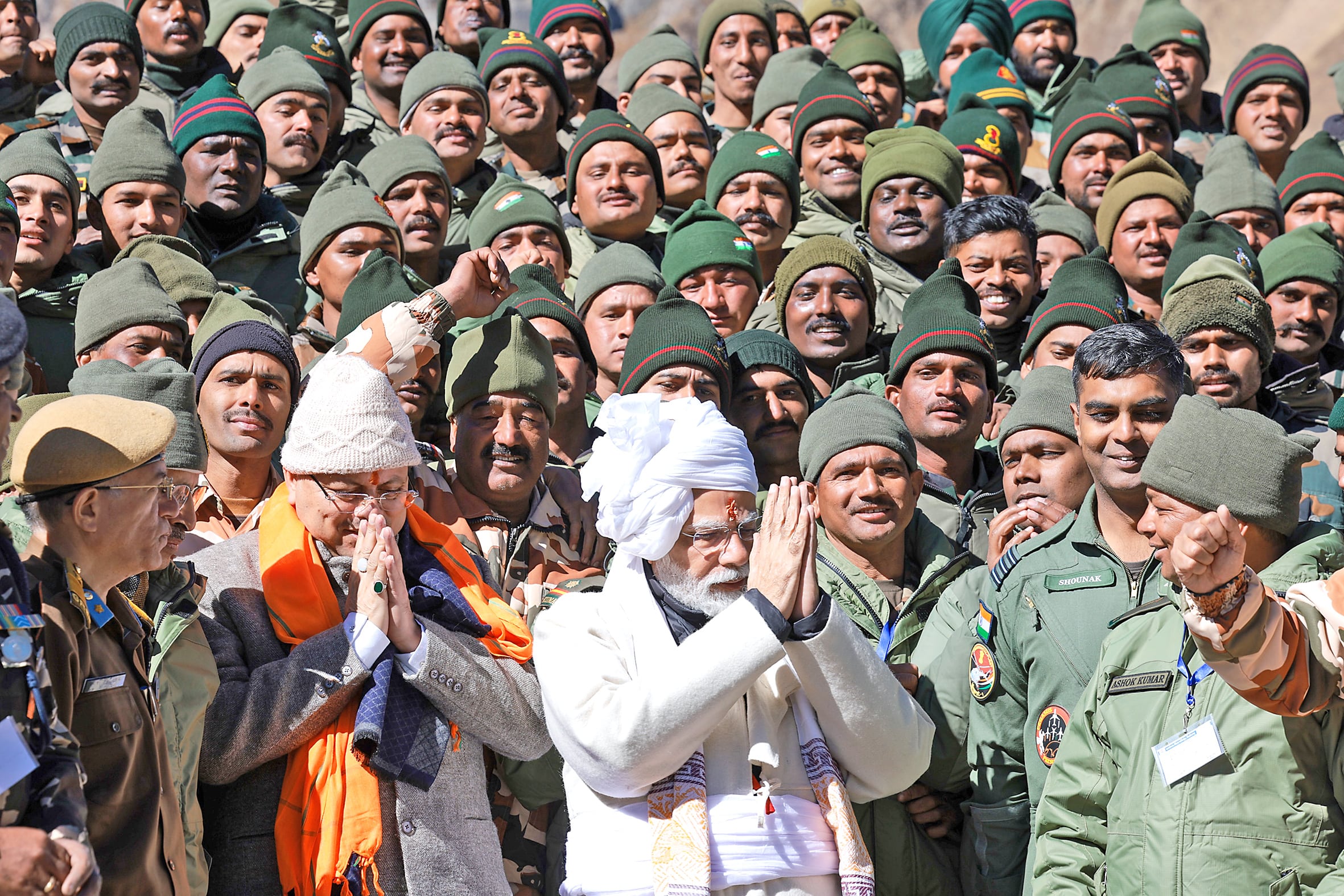 PM Narendra Modi and CM Pushkar Singh Dhami greet ITBP personnel after offering prayers at Parvati Kund.