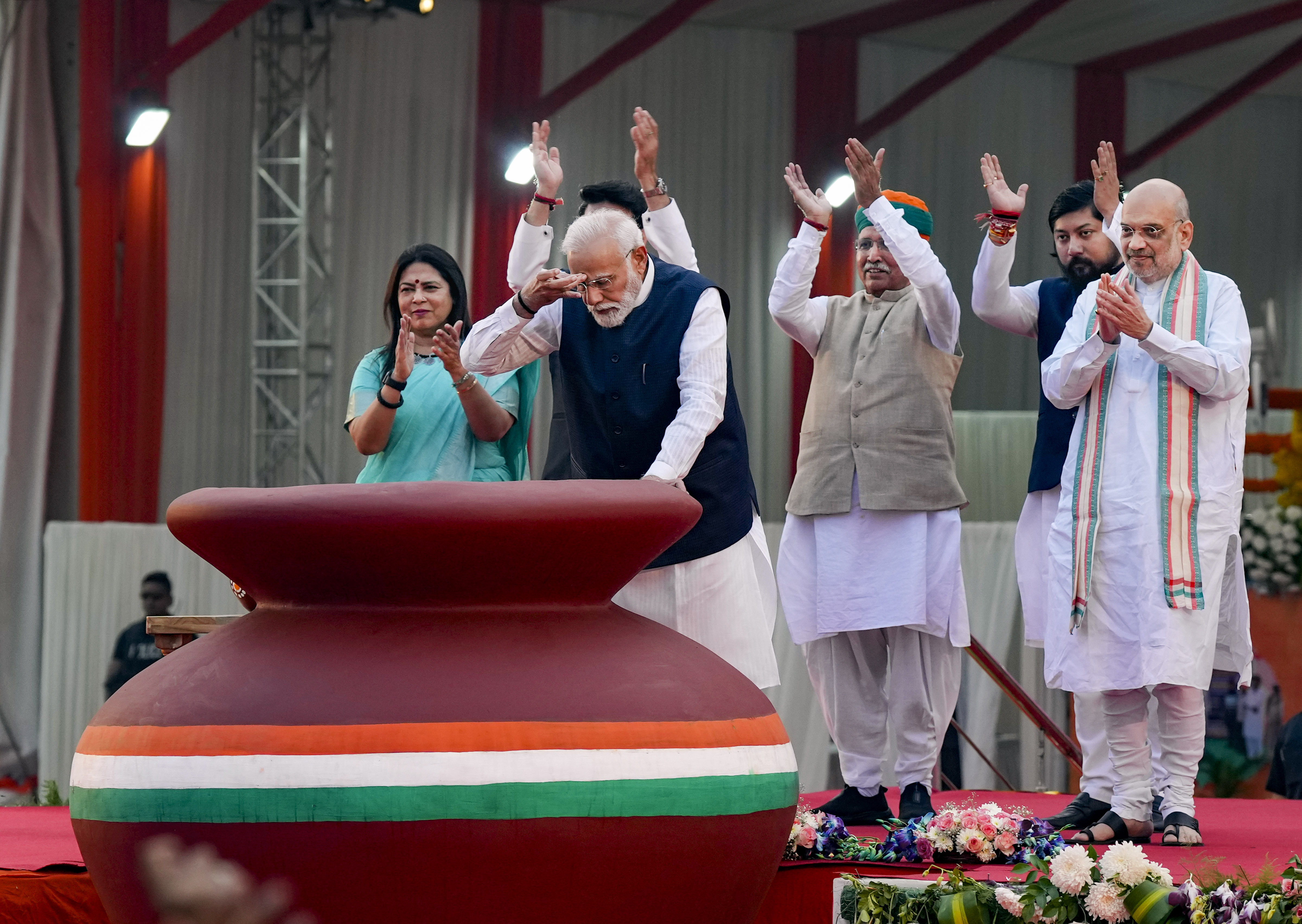 Prime Minister Narendra Modi during an event marking the culmination of the 'Meri Maati Mera Desh' campaign, in New Delhi, on Tuesday. Union Ministers Amit Shah, Arjun Ram Meghwal, Meenakashi Lekhi and Nisith Pramanik are also seen. -PTI