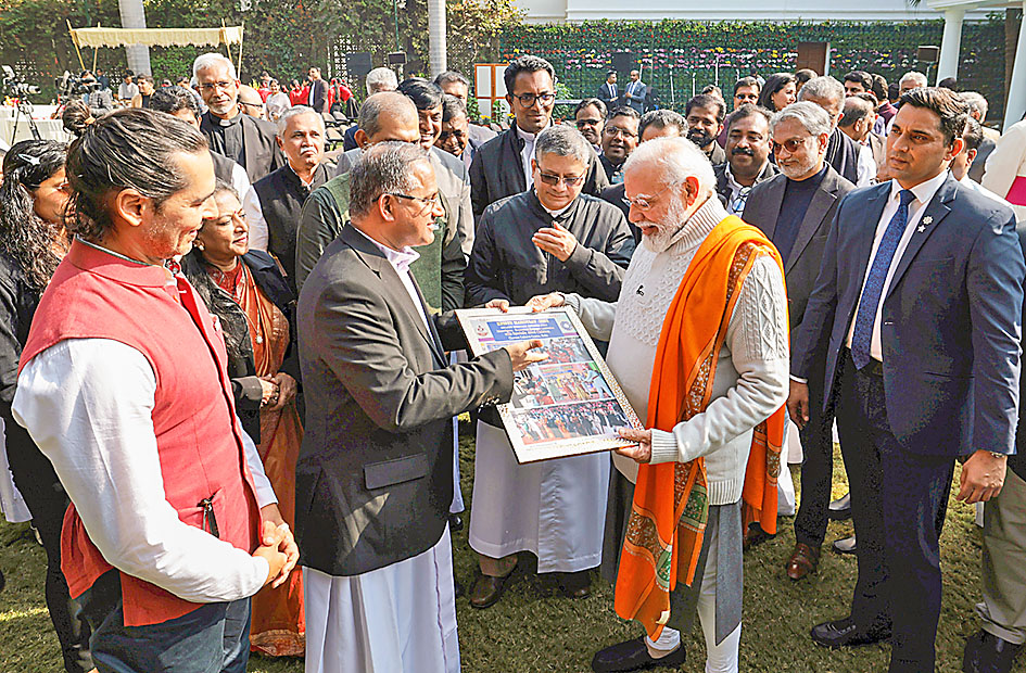 PM Modi being felicitated by the members of the Christian community.