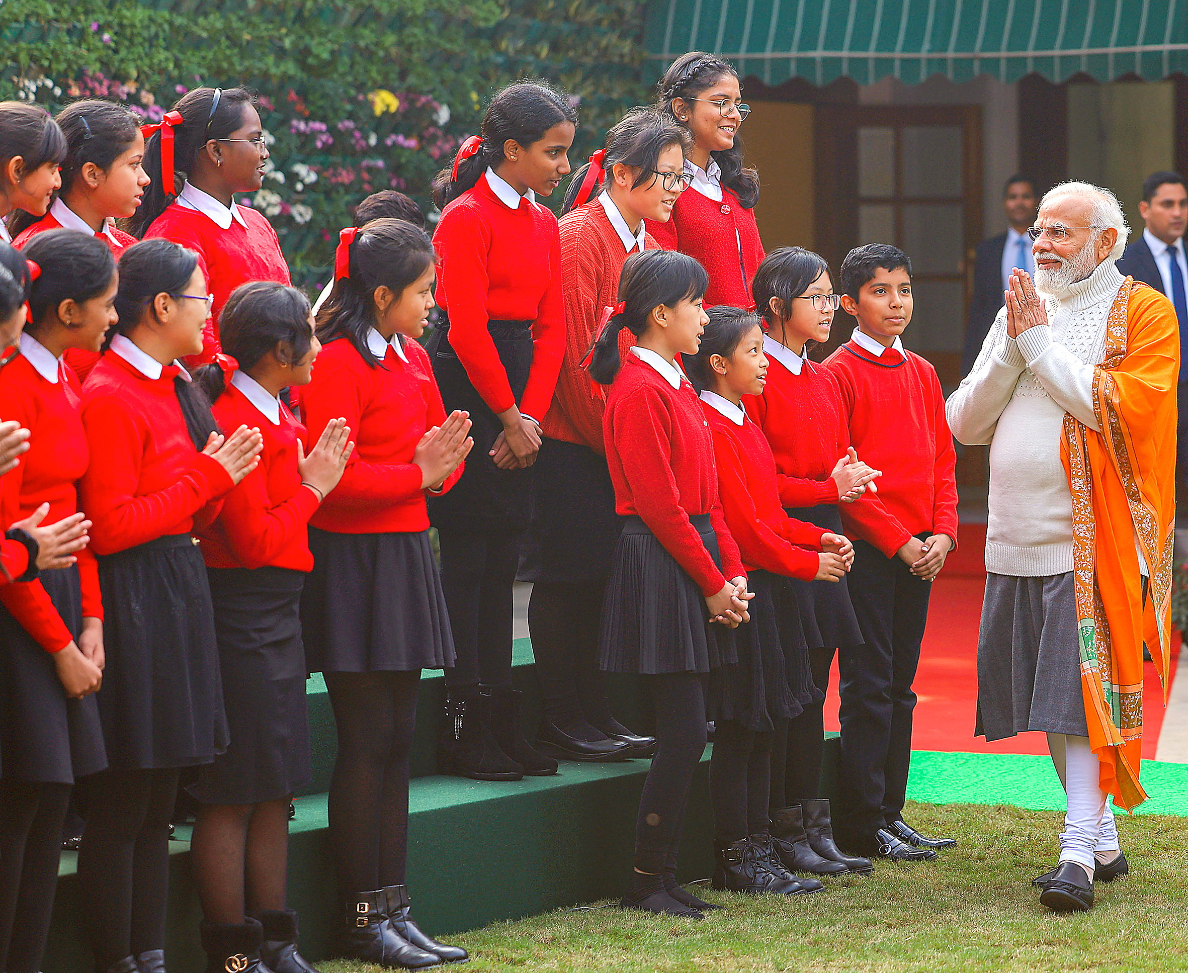 PM Modi being welcomed by children during the event.
