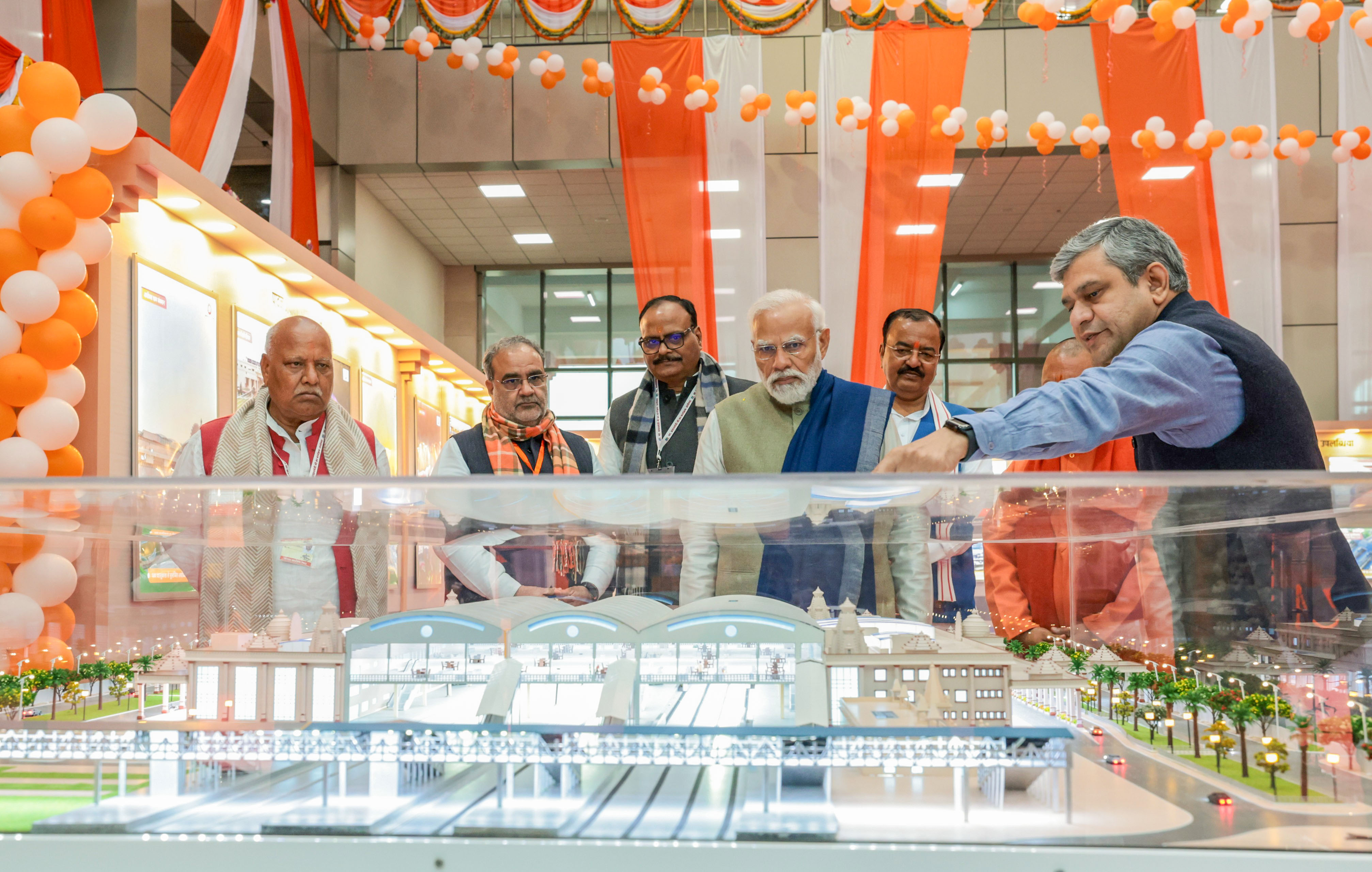 Prime Minister Narendra Modi inspects the replica after inaugurating the Ayodhya Dham Junction railway station in Ayodhya on Saturday. Union Railway Minister Ashwini Vaishnaw and others are also seen