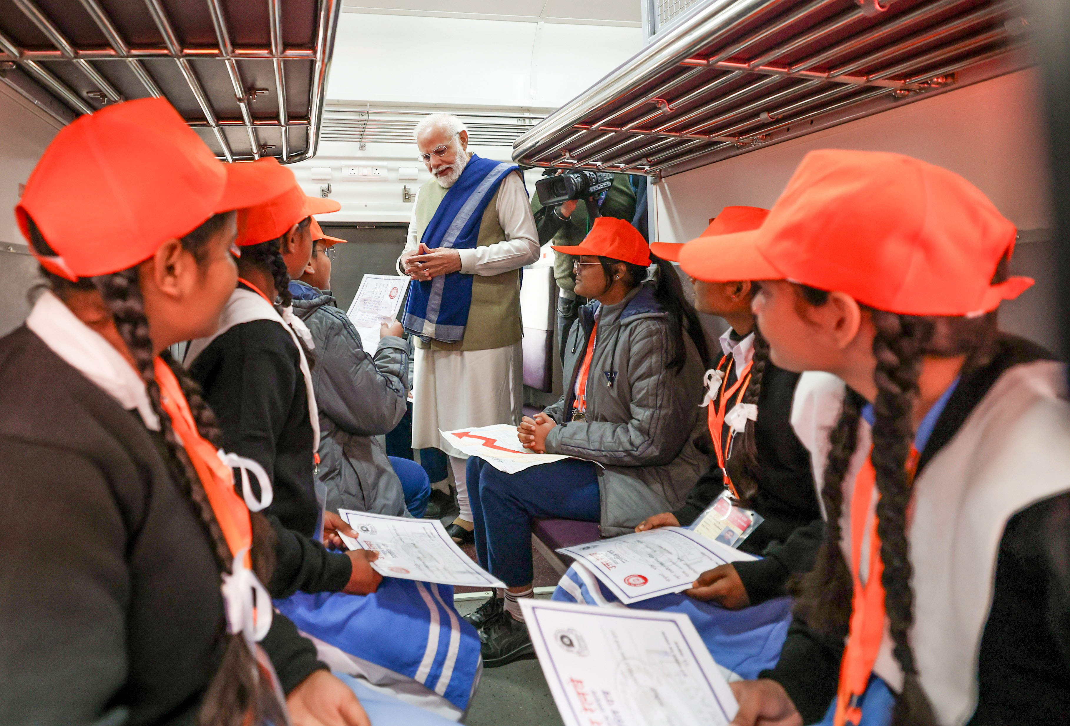 Prime Minister Narendra Modi interacts with students onboard the Amrit Bharat train after inaugurating it, in Ayodhya on Saturday.