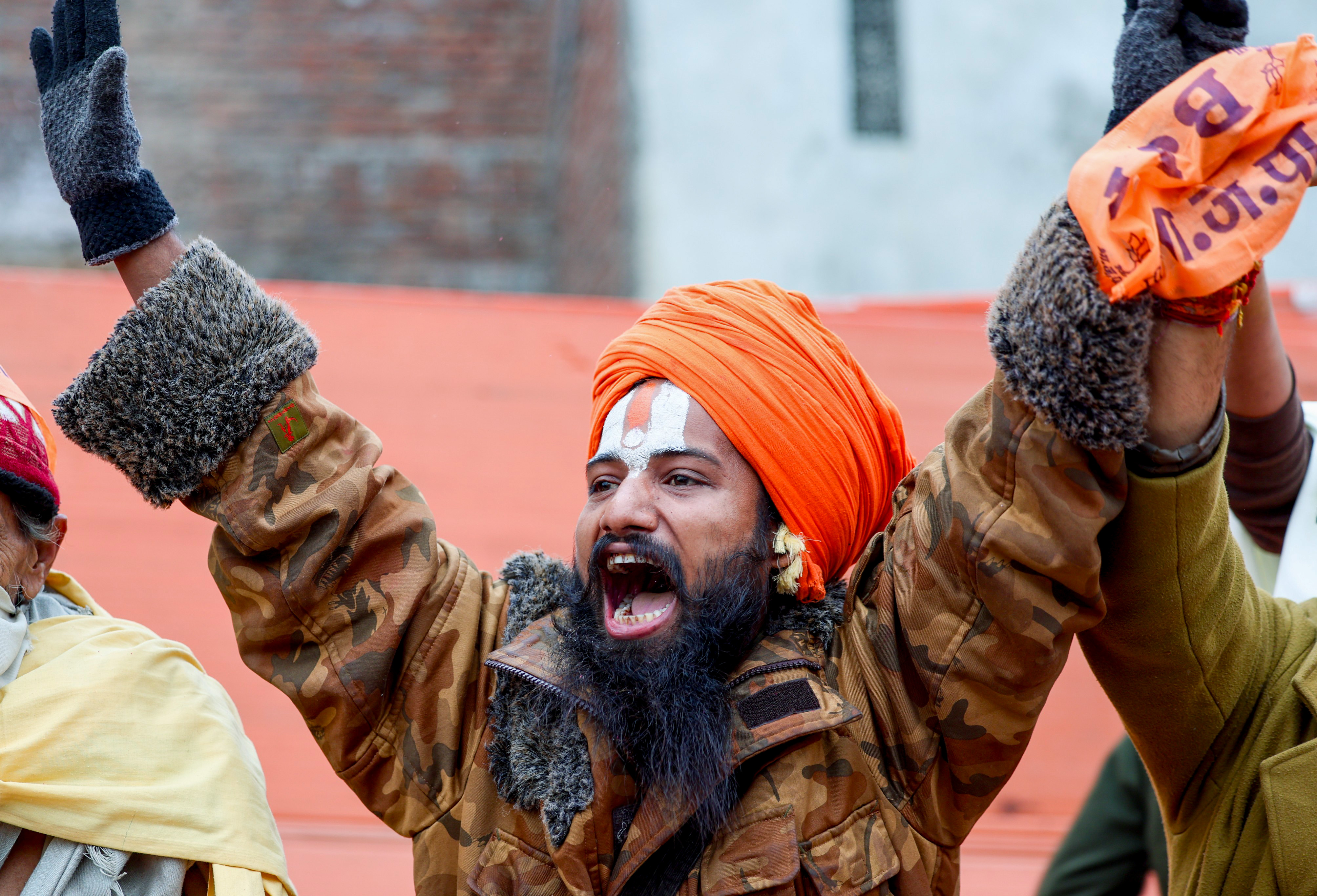 A Sadhu in a jubilant mood warmly welcomes Prime Minister Narendra Modi (unseen) upon his arrival in Ayodhya on Saturday.