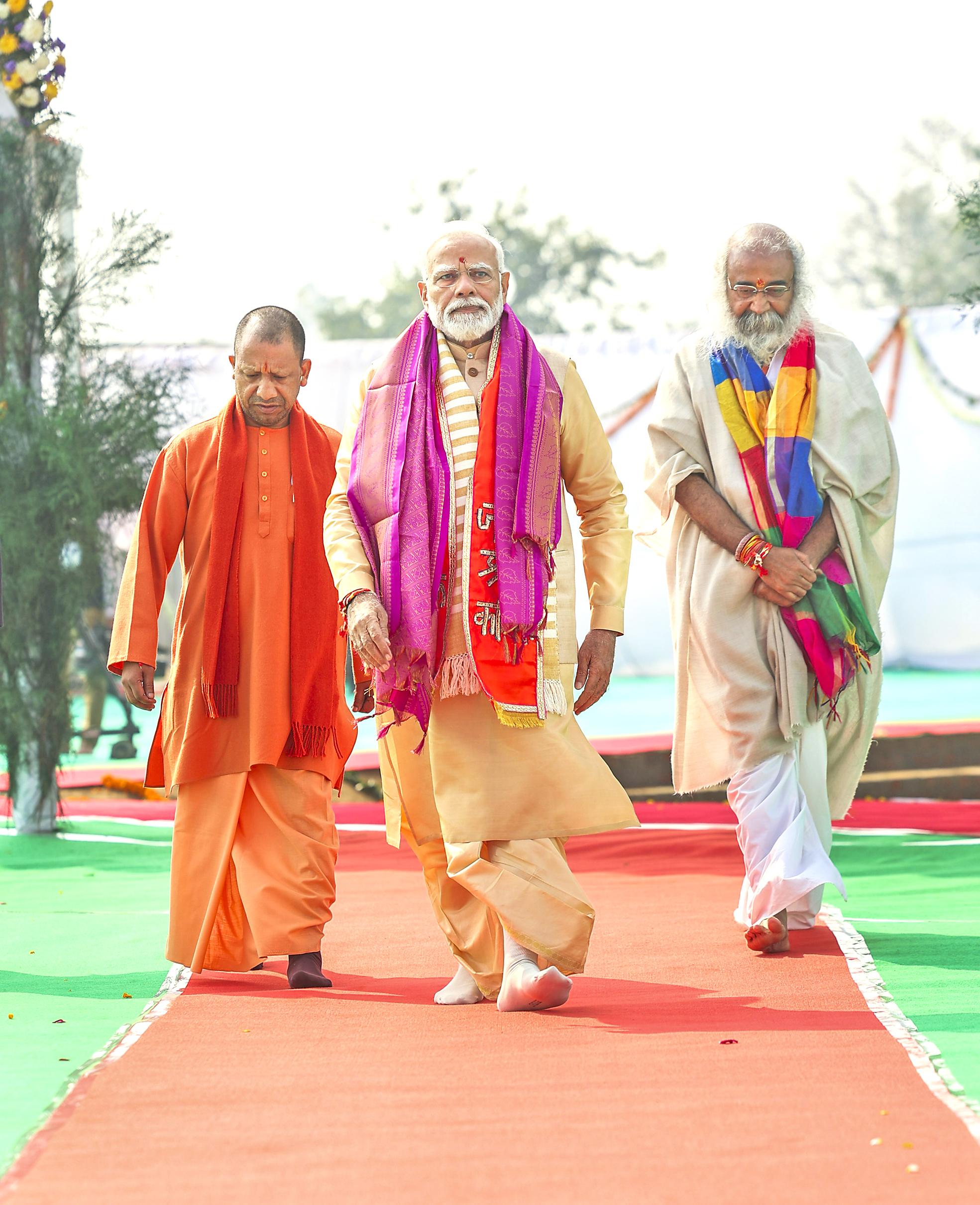 PM Narendra Modi with UP CM Yogi Adityanath and Acharya Pramod Krishnan during foundation stone laying ceremony of Shri Kalki Dham.